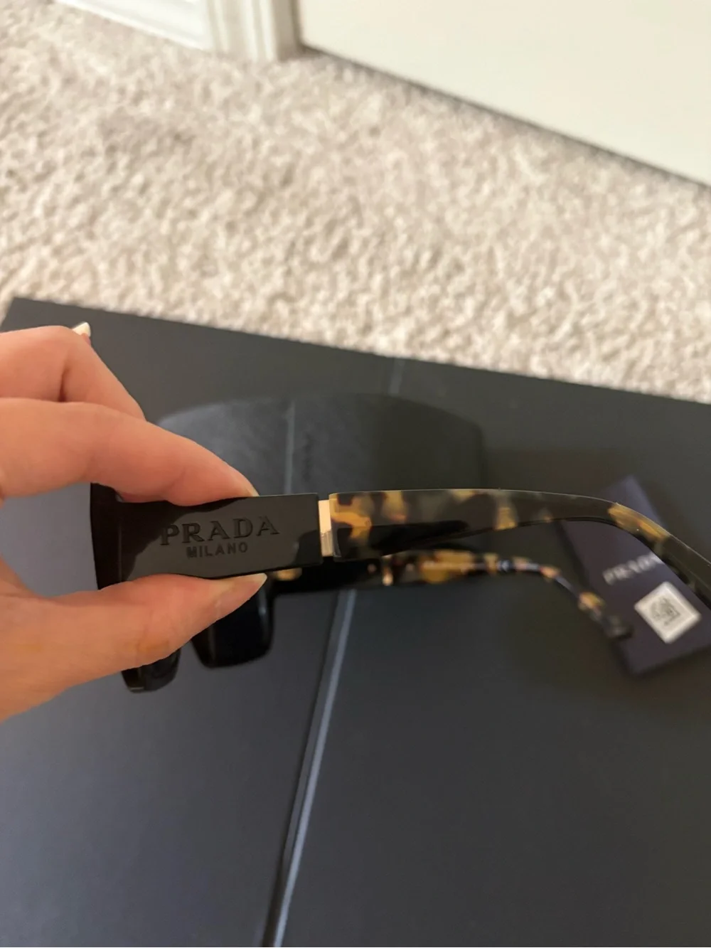 Prada Black Frame Sunglasses with Tortoiseshell Temples
